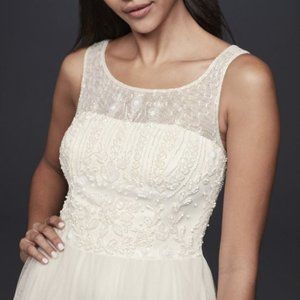New with tags, beaded & tulle long wedding dress!